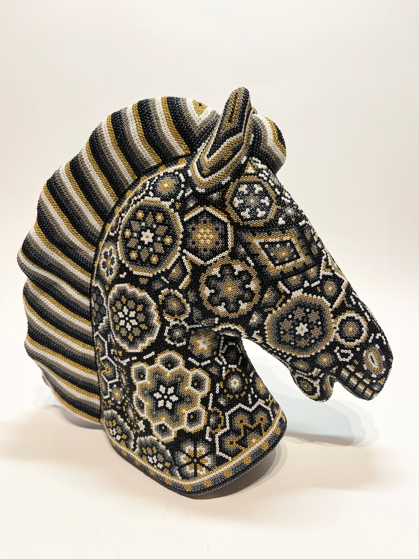 Large horse head white, gold, and black