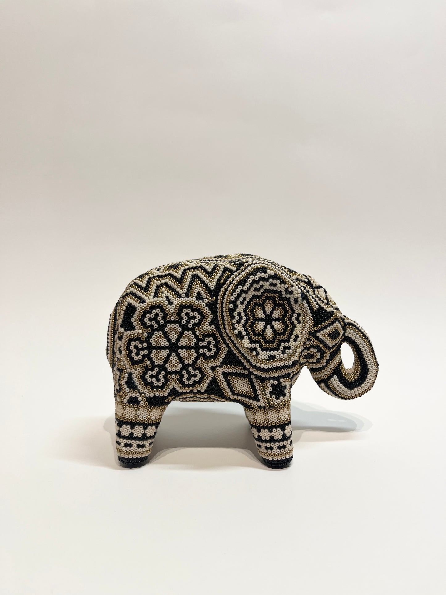 Small elephant black, white and gold