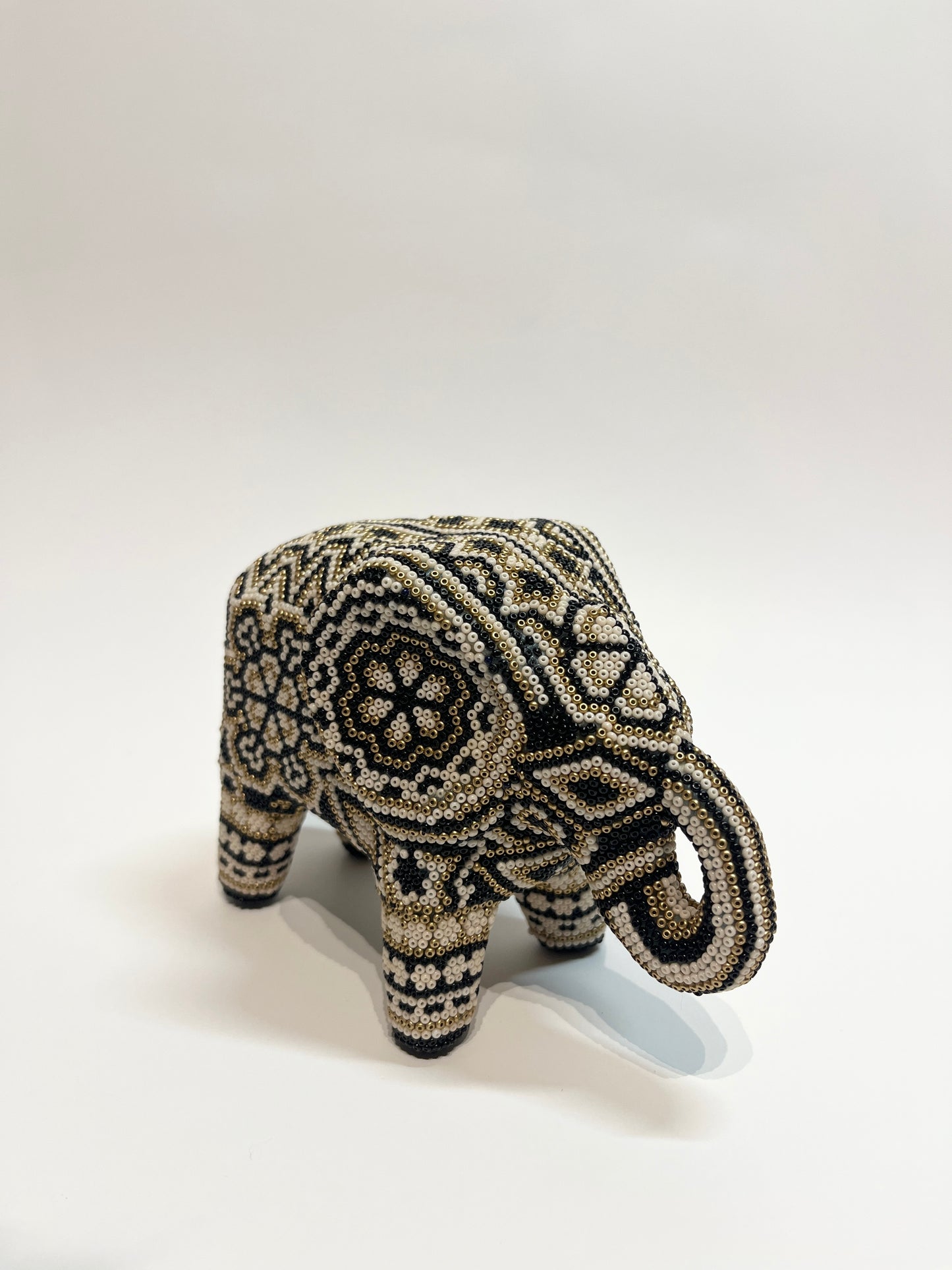 Small elephant black, white and gold